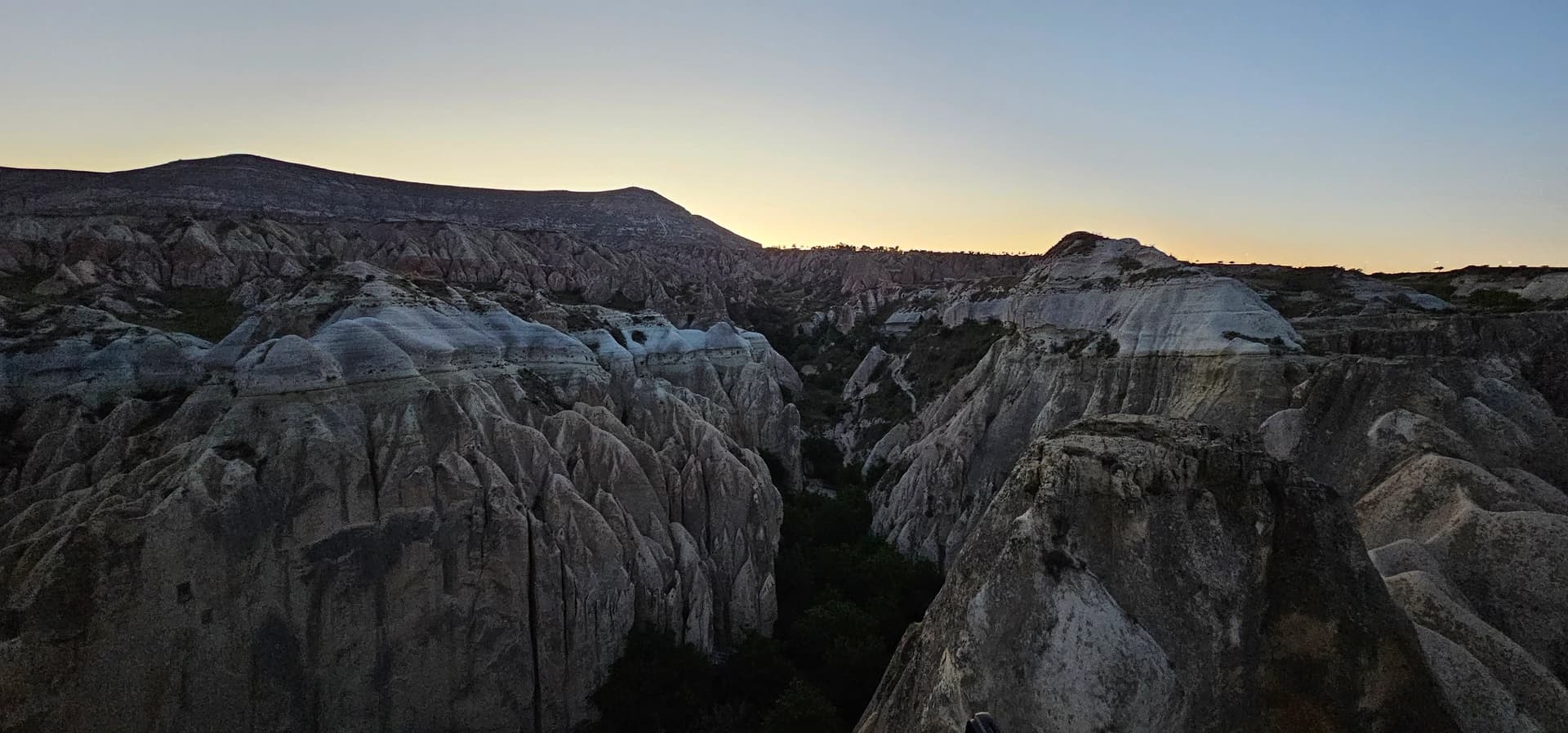 Scenic view of Cappadocia with hot air balloons